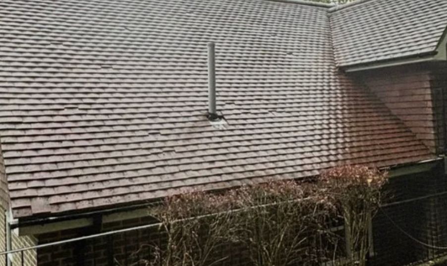 Clean tiled roof after moss removal