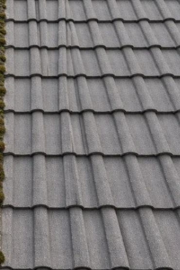 Red tiled roof cleaned by Arcline